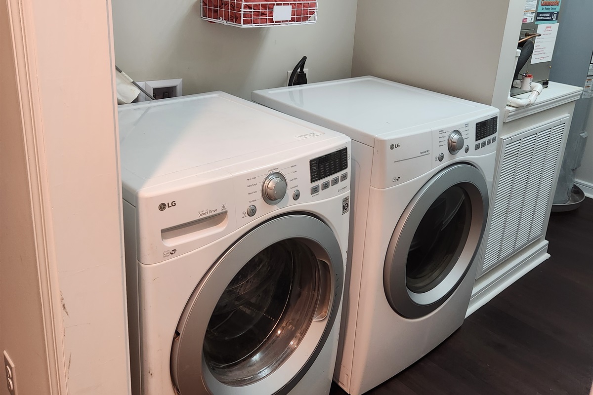 Tucked neatly into a dedicated space, this front-loading washer and dryer setup makes keeping up with laundry effortless.
