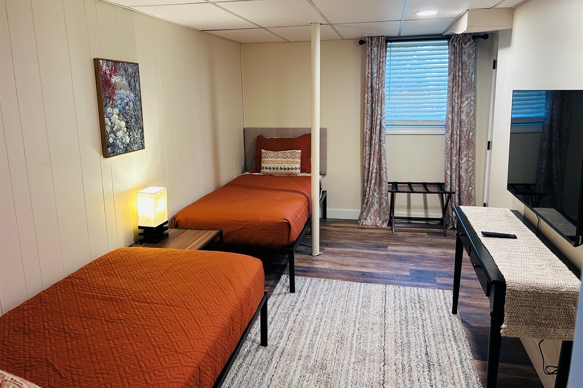 Two twin beds w/Smart TV in basement bedroom