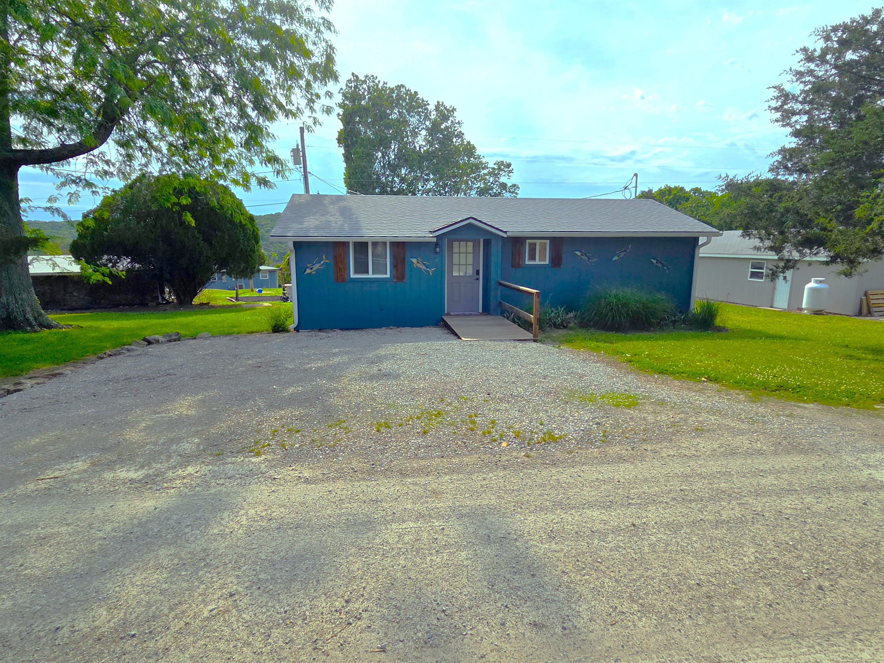 Don't be fooled -- this is a great size cabin with ample free parking for several vehicles, boat, water toys, etc.!