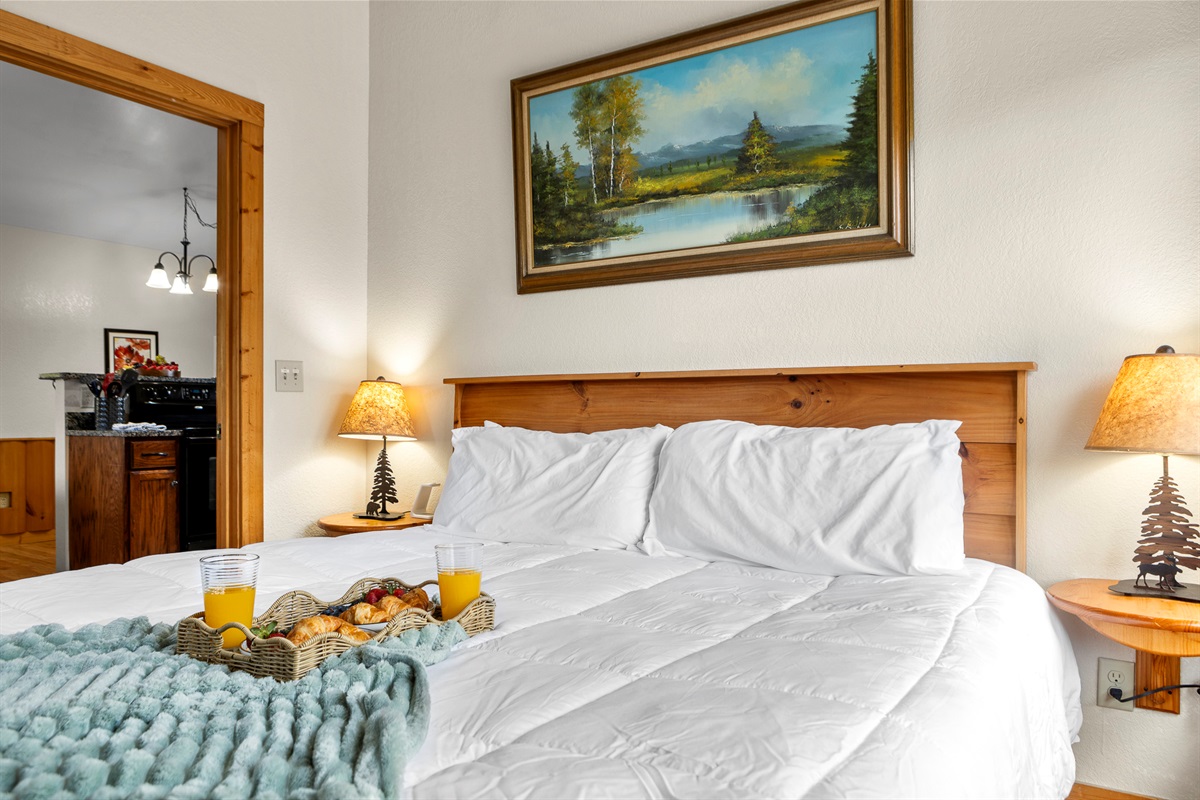 Bedroom Retreat: Enjoy mountain views and a delightful breakfast spread to start your day!

