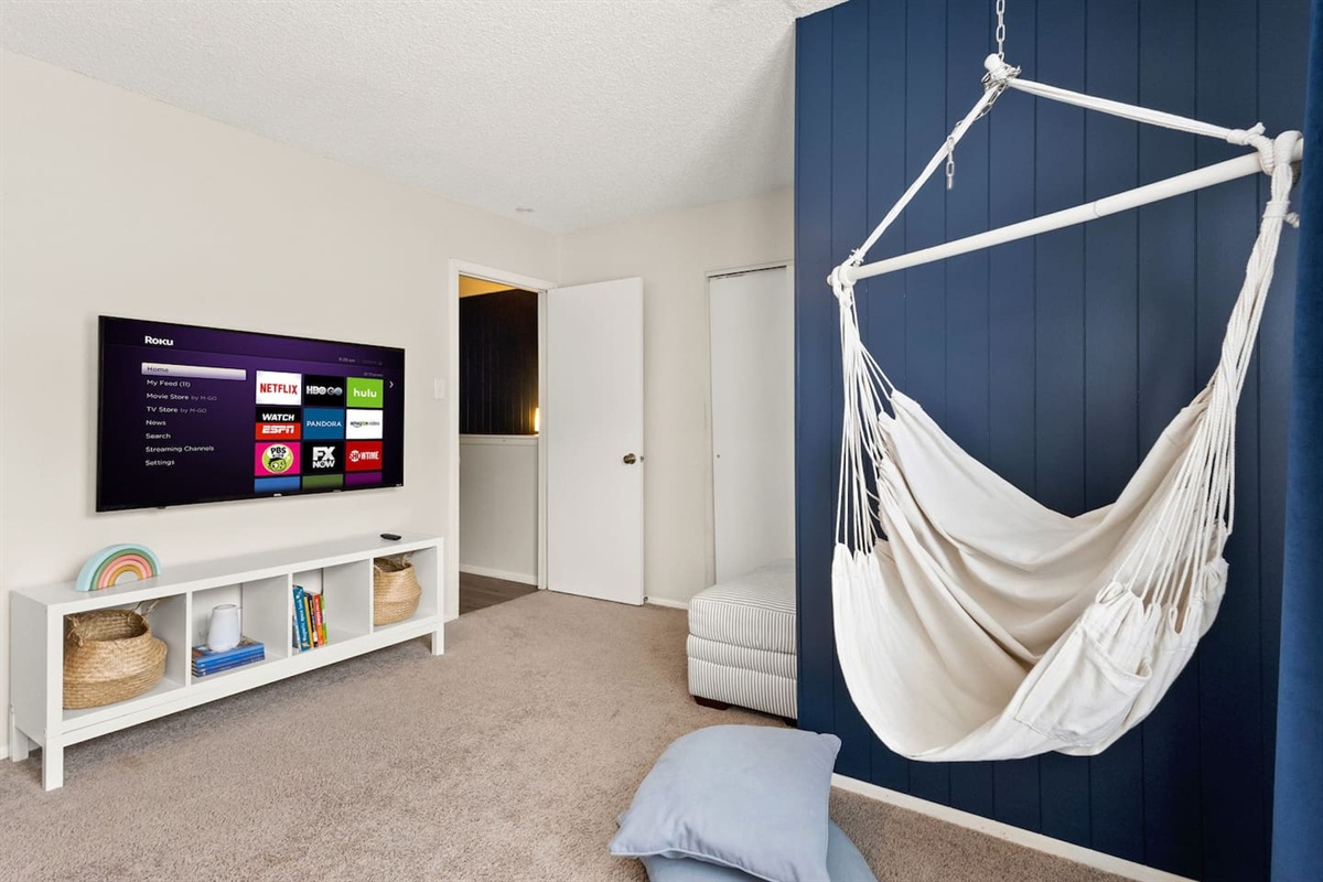 Curl up on the hanging chair and enjoy a family movie evening.