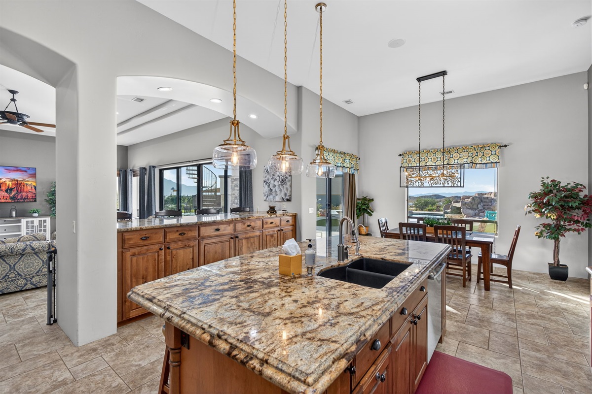 Open kitchen and dining layout with natural light and seating for gathering — designed for shared meals and memories