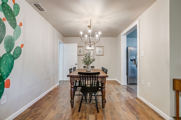 View from hallway to open dining area, blending rustic and modern styles