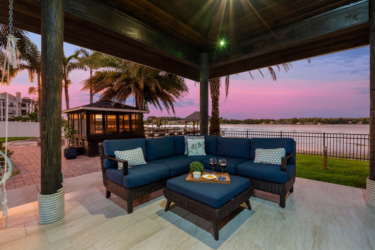 As the sun sets over the water, this open-air pavilion transforms into the perfect spot for dining, lounging, and entertaining.