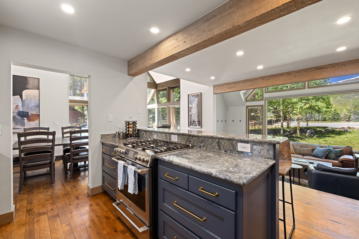 Kitchen with gas stove, convection oven, and warming drawer.