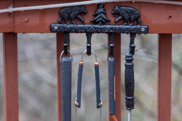 Grill accessories located next to gas grill.