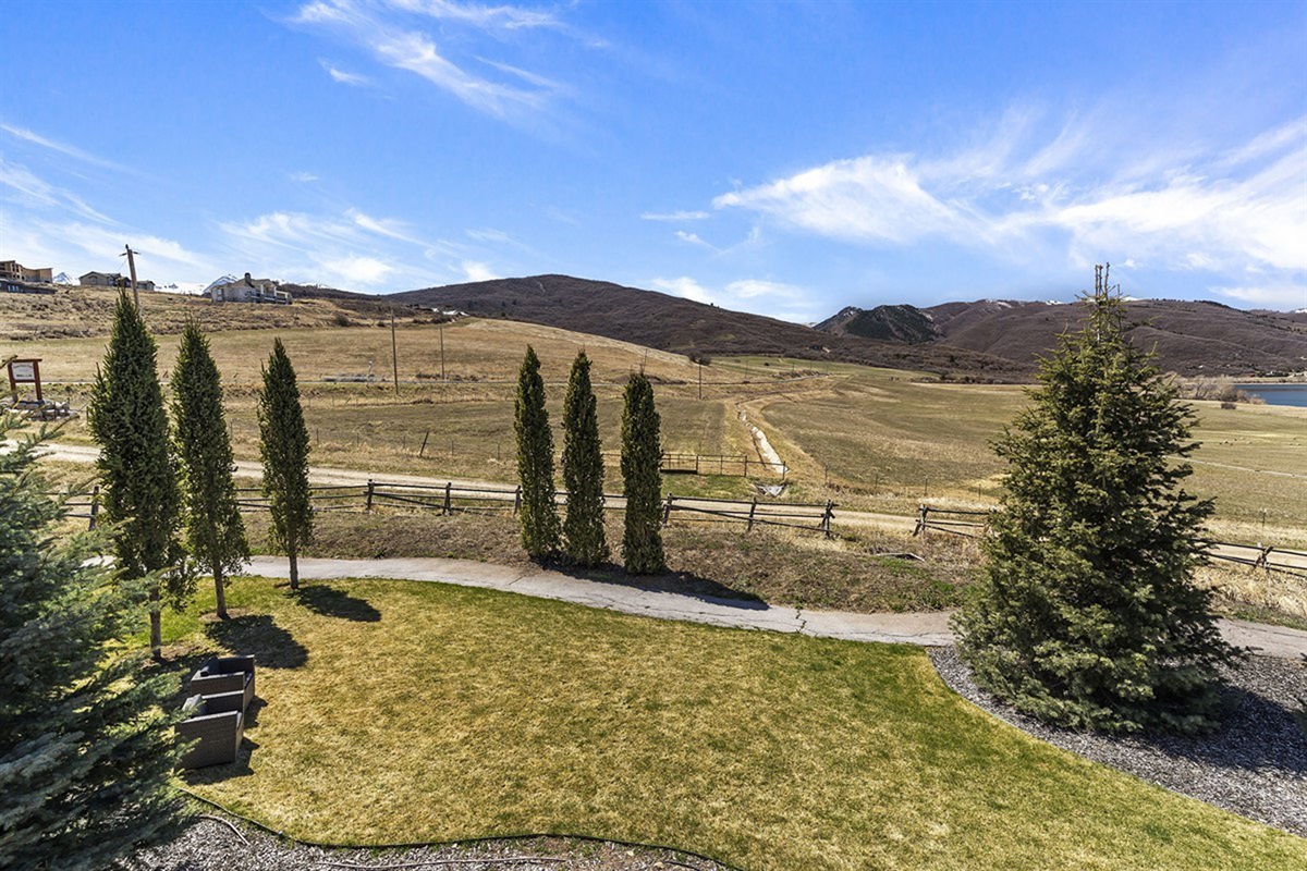 Wide-open lawns and scenic walking paths provide a tranquil environment for morning strolls, framed by sweeping valley and mountain views.