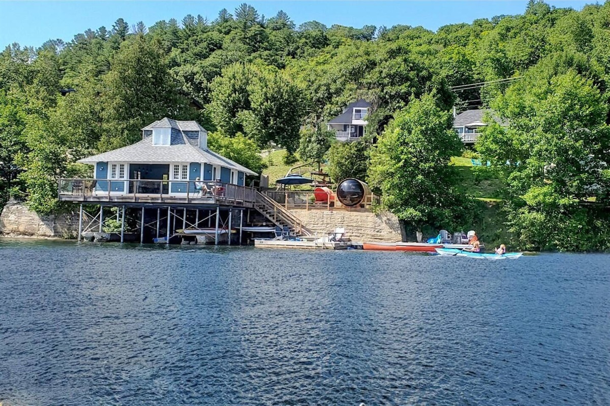 Summertime view of Le Domaine from out on Lac McGregor