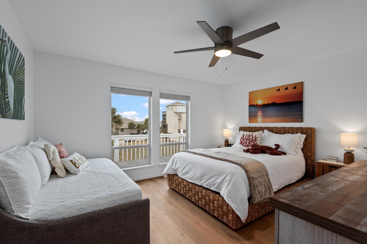 The Sunset bedroom on the first floor is adorned with a Queen Bed and a Twin Daybed with Twin Trundle, providing a cozy retreat.