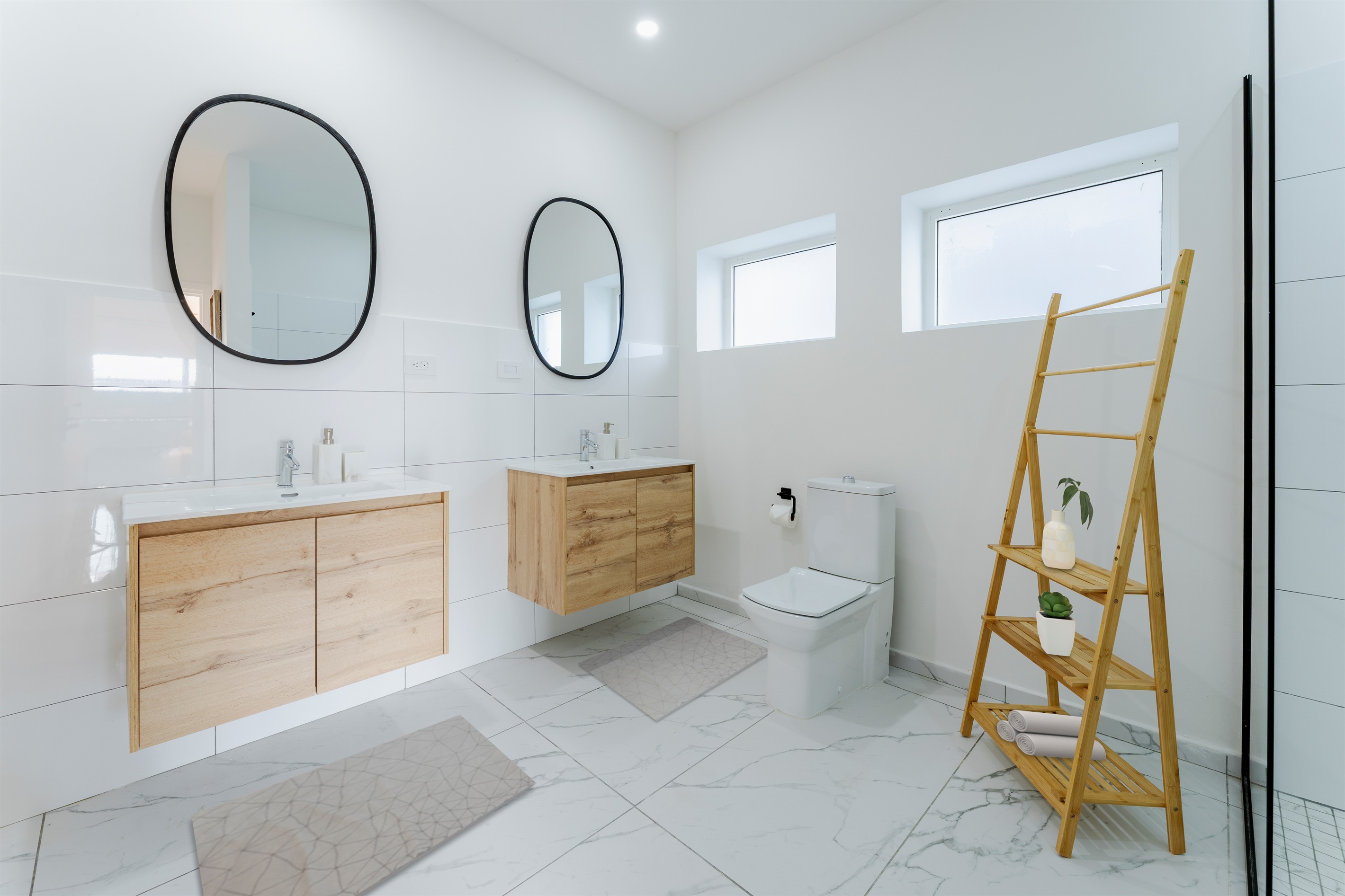 Features a floating double vanity and plenty of space to get ready