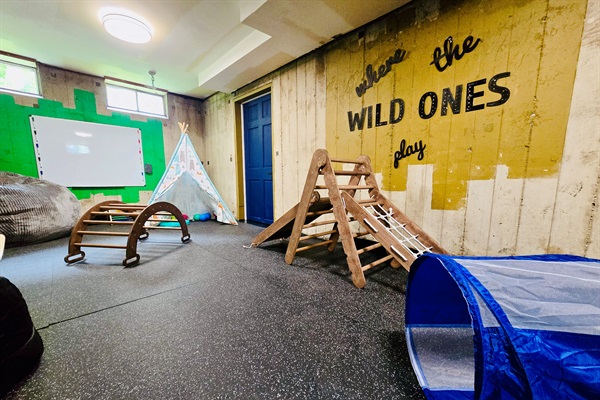 A space built for imagination—ND hues, industrial charm, and a cozy corner where the wild ones can play, dream, and be themselves.