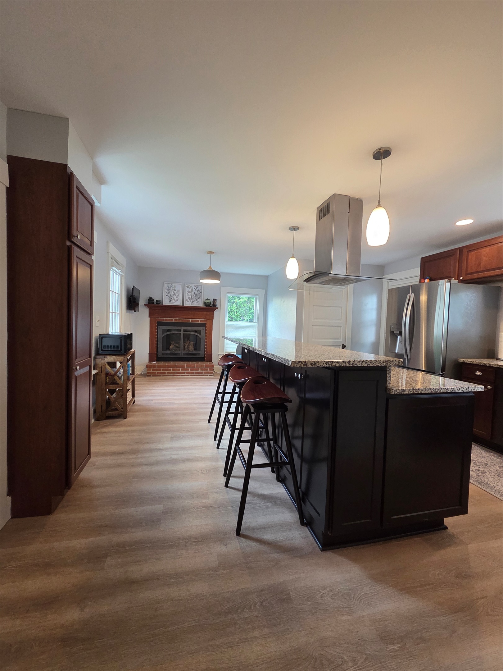 View of Kitchen Sitting/TV area and Kitchen Island