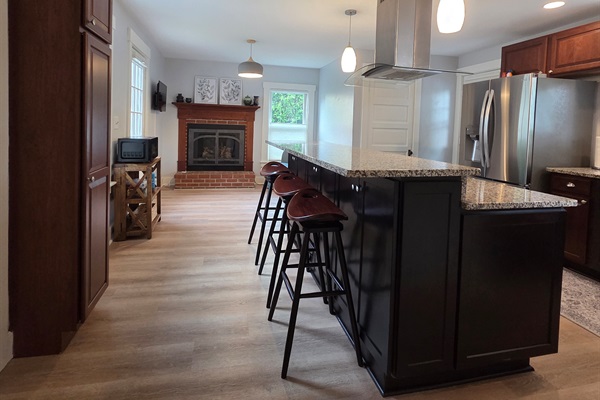 View of Kitchen Sitting/TV area and Kitchen Island