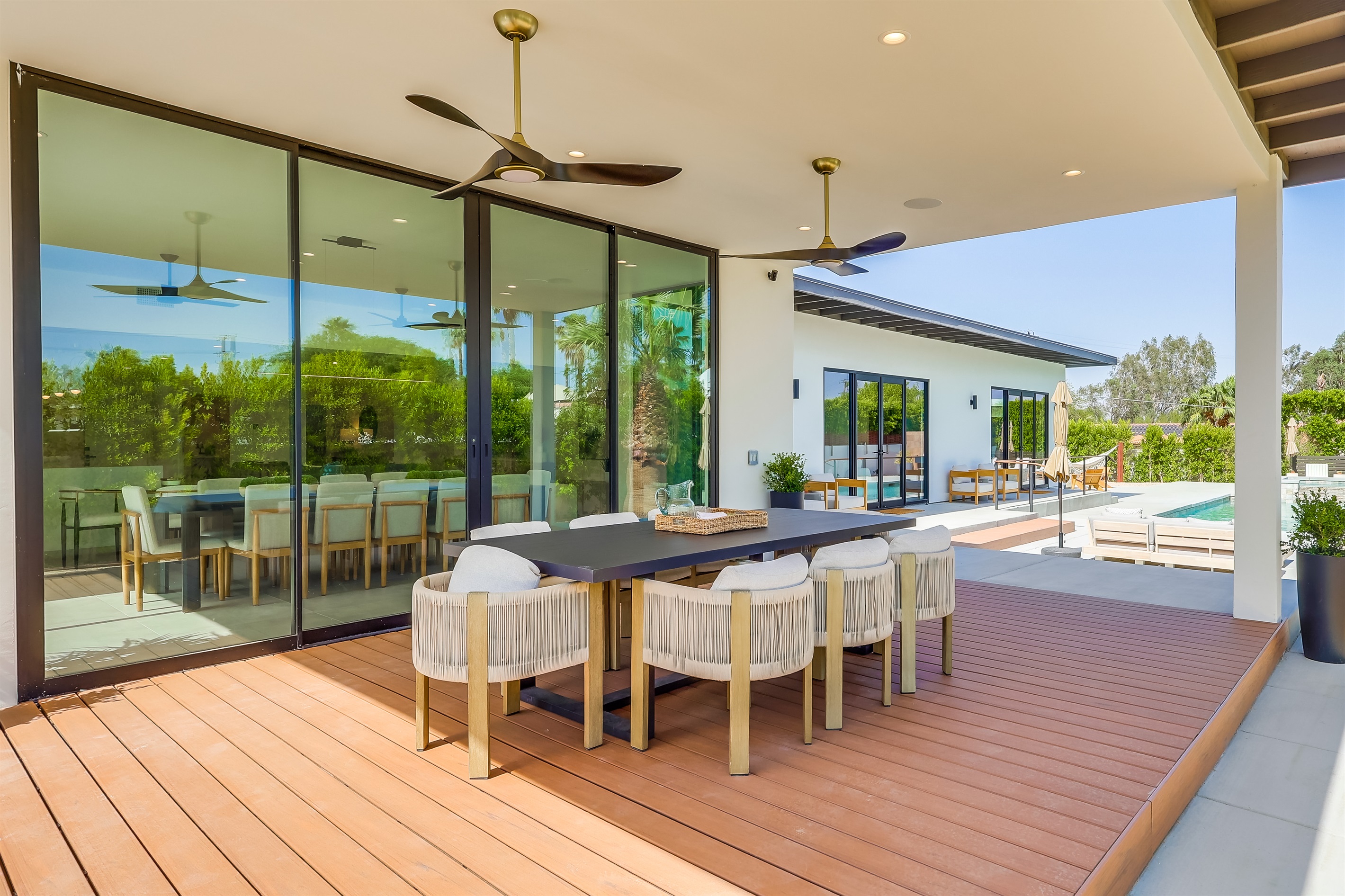 Outdoor dining under 10' canopy and equipped with ceiling fans