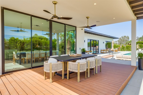 Outdoor dining under 10' canopy and equipped with ceiling fans