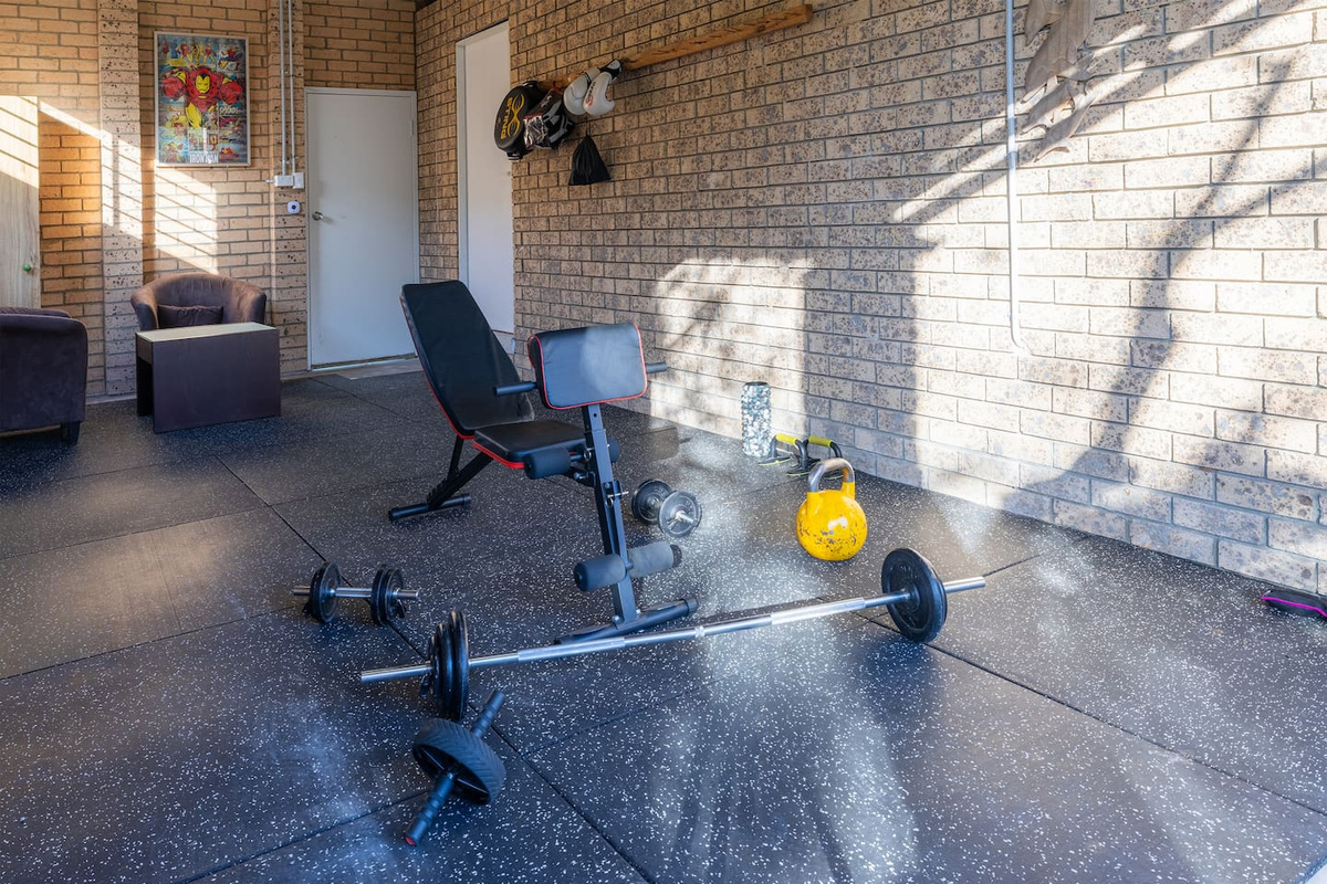 Open floor space, natural light and practical gym gear give Luna’s Sanctuary an extra amenity beyond the main living and games areas.