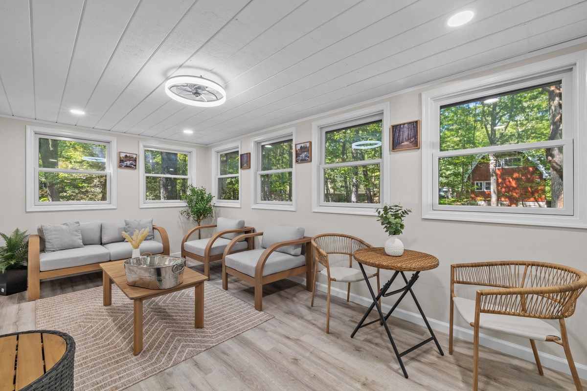 Start your morning in the sunroom with a fresh coffee—windows opening up to a full view of the Poconos tree canopy