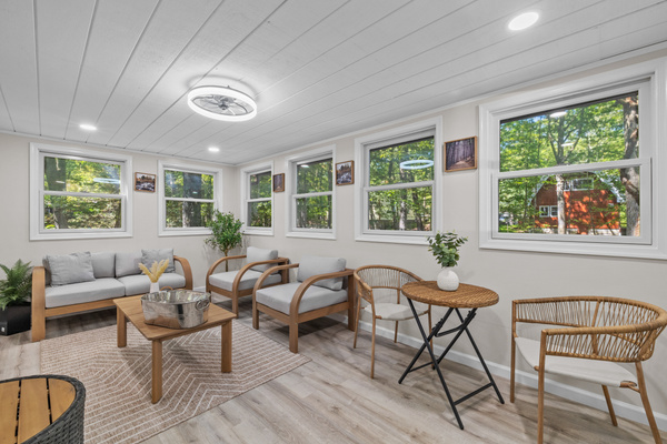 Start your morning in the sunroom with a fresh coffee—windows opening up to a full view of the Poconos tree canopy