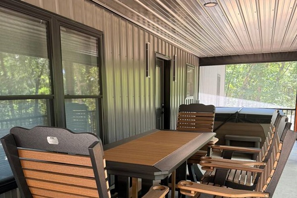 Outdoor table seating for 6 in the screened in porch. 