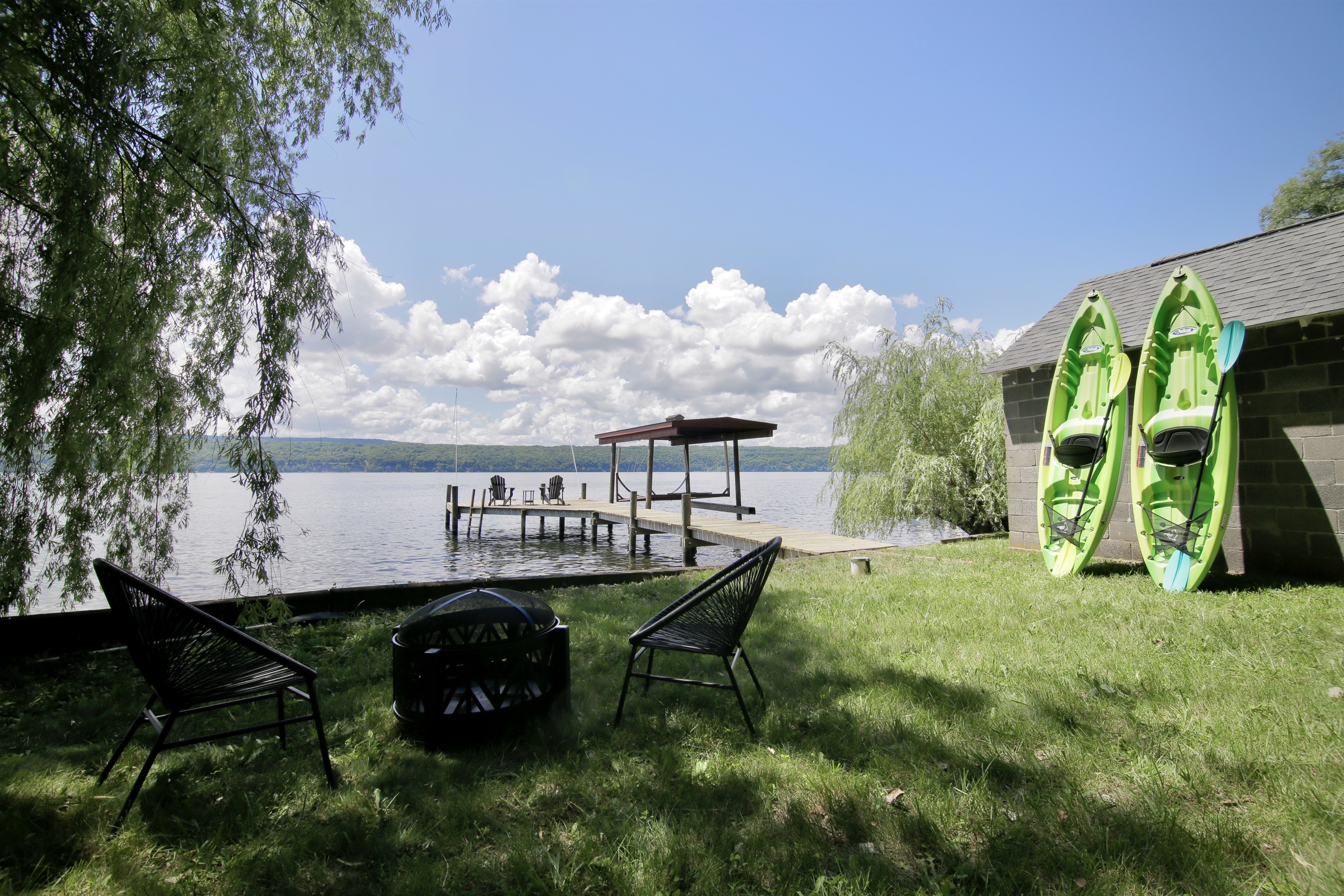 Grass Beach Area | Partially Shaded | Two Kayaks & Life Jackets | Chairs and Loungers Available | Fire Pit