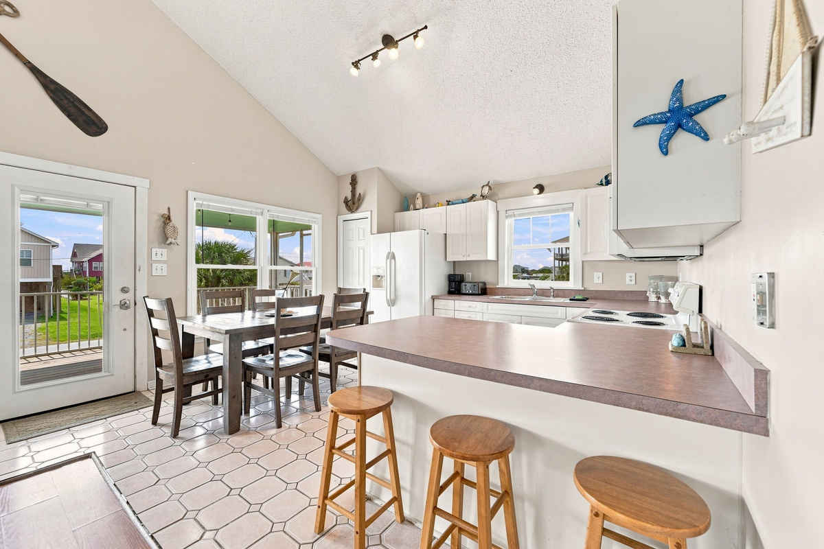 Gather around the breakfast bar for a quick bite, morning coffee, or conversation while meals are prepared