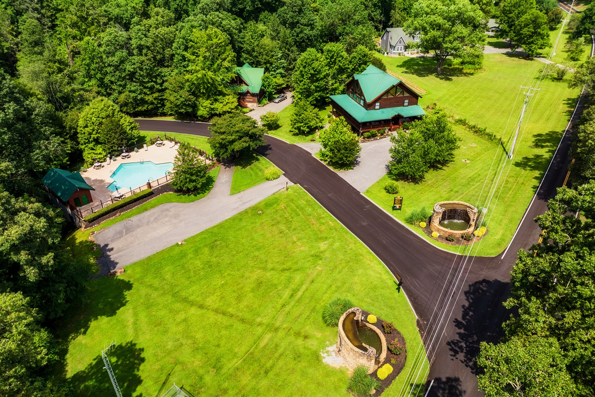 Beautiful aerial view of the smoky Cove resort community showing the outdoor community pool and entrance to the resort