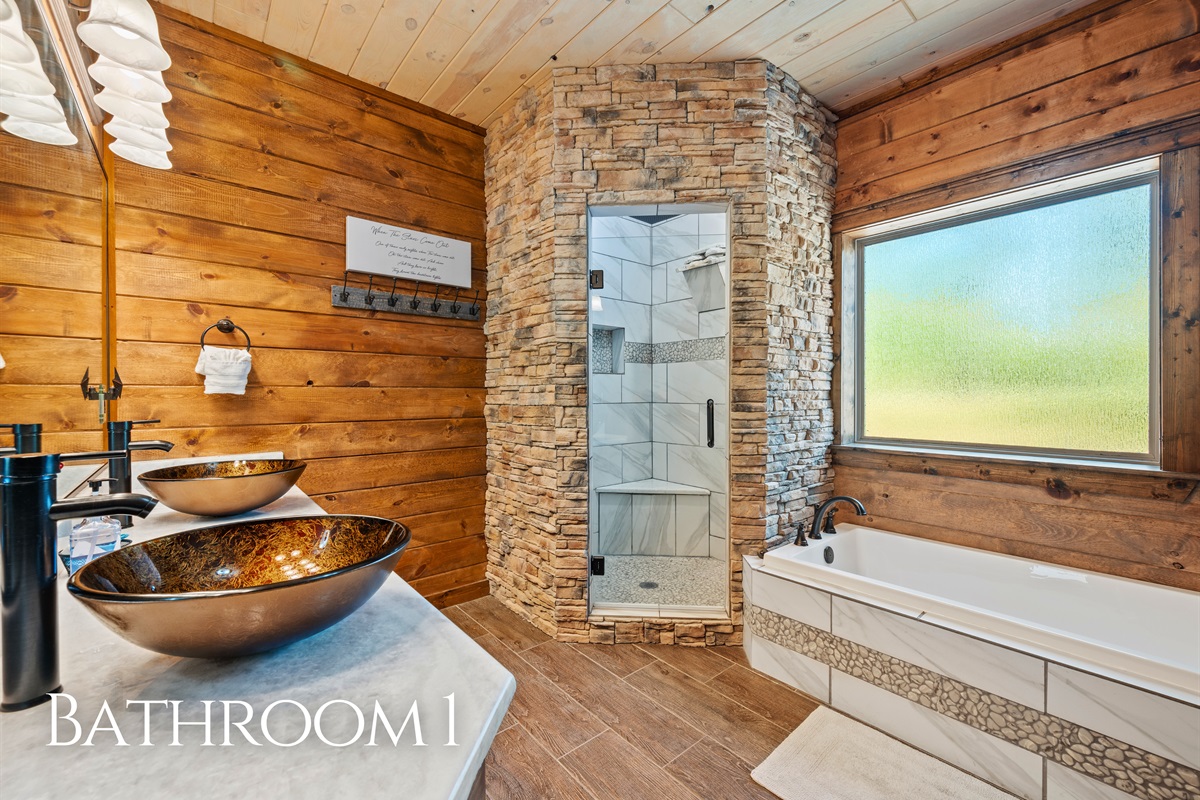 A spacious bathroom includes a soaking tub and walk-in shower, giving you a spa-like experience during your stay.