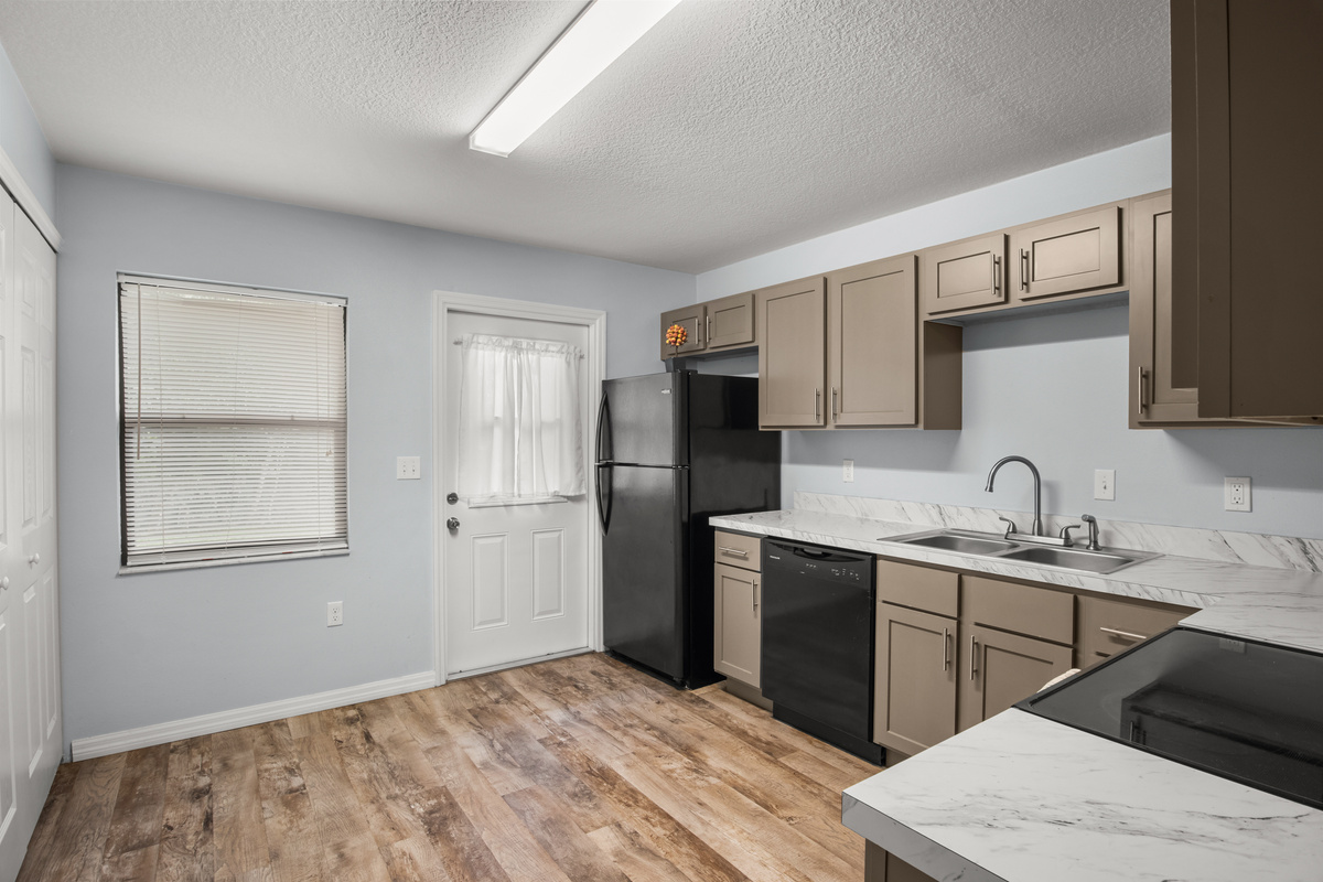 The kitchen door connects to the backyard patio.
