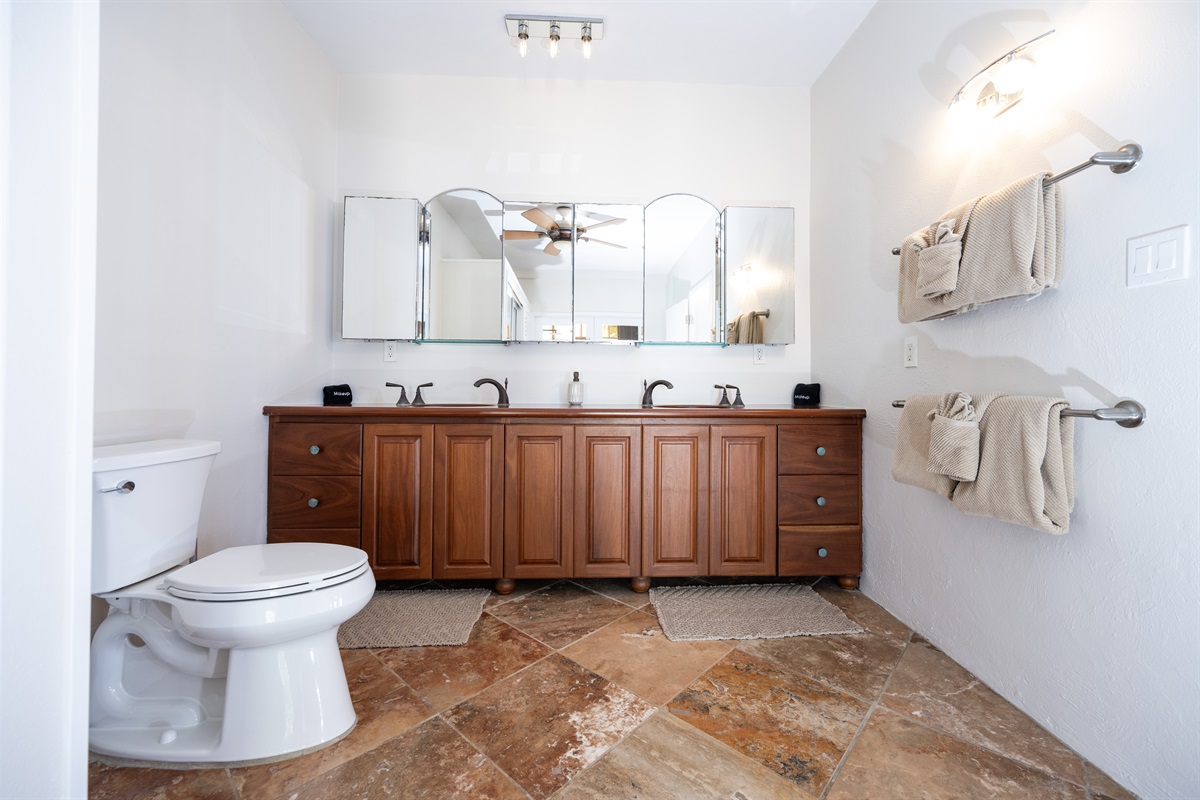 Main Floor Primary Bathroom with double sinks and ocean-inspired details.