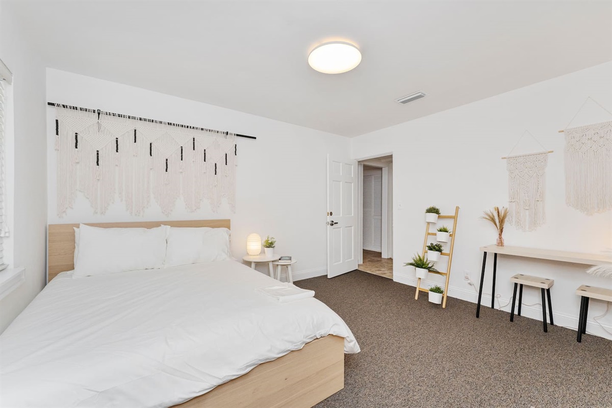 Peaceful guest room w/ desk & soft lighting for unwinding