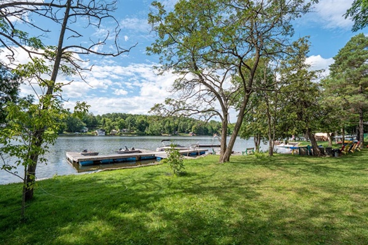 Green lawn and waterfront area near Cottage #6