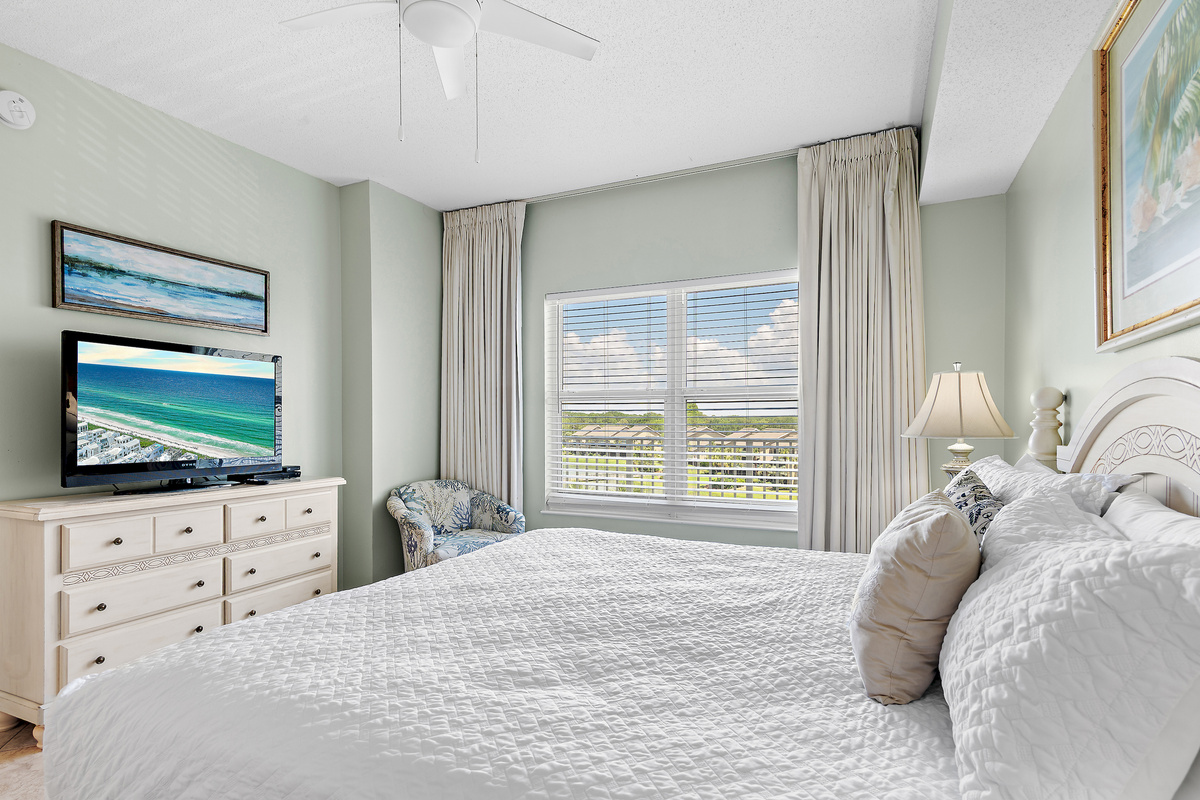Primary bedroom which features a King Bed, new furniture, Smart TV, large closet, and private bathroom with dual vanity