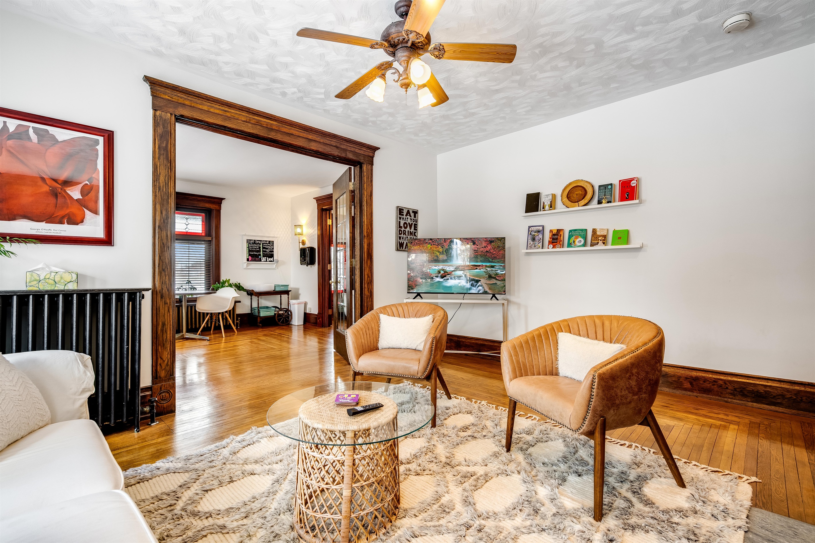 Shared living space with fireplace and tv.