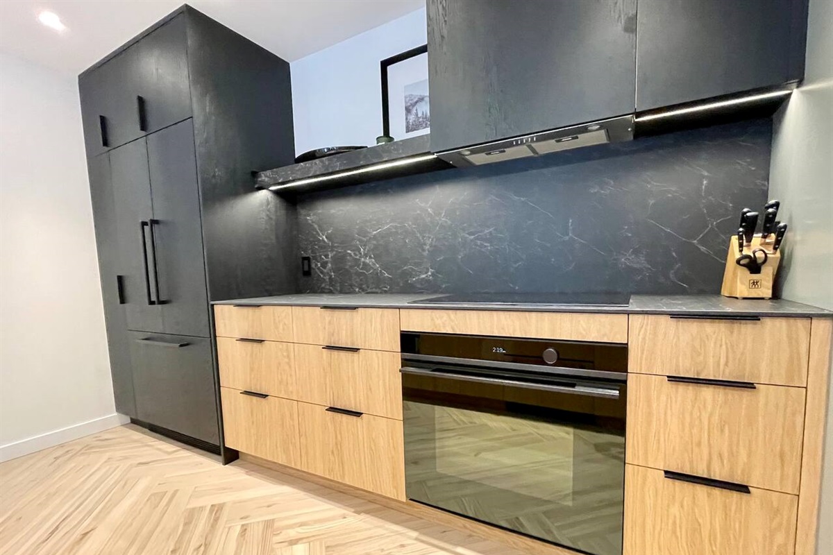 Gourmet grade kitchen offers tons of prep & service space + Fisher Paykel Appliance Package w/Convection Oven, Induction Cooktop, Refrigerator w/icemaker & Dual Drawer Dishwashers. Dedicated beverage fridge & microwave complete the offering.