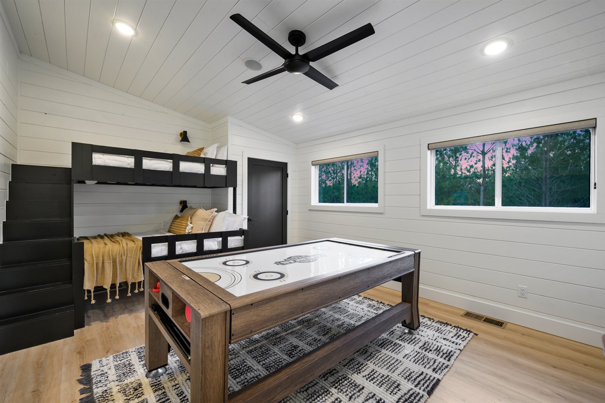The spacious loft features built-in bunk beds and a full-size game table for endless entertainment.