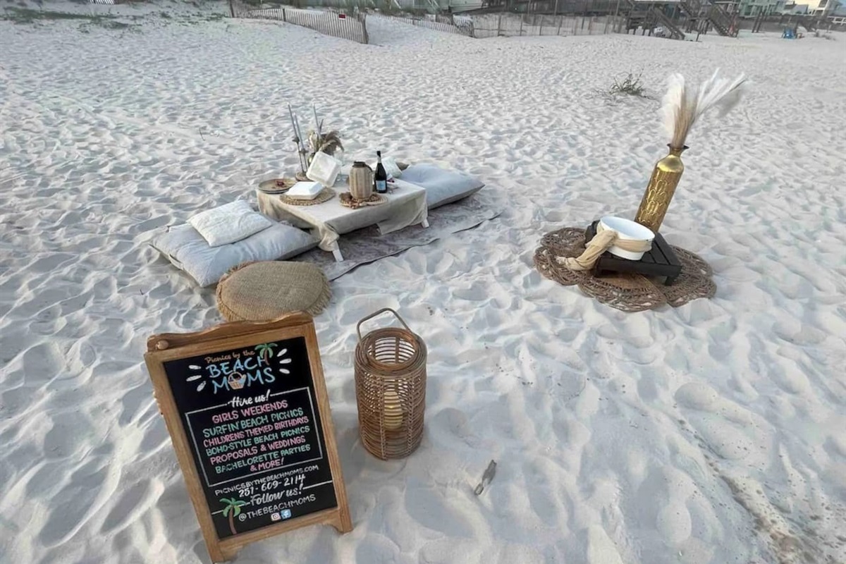 Dreamy beach picnic setup for special celebrations with cozy vibes and ocean views.