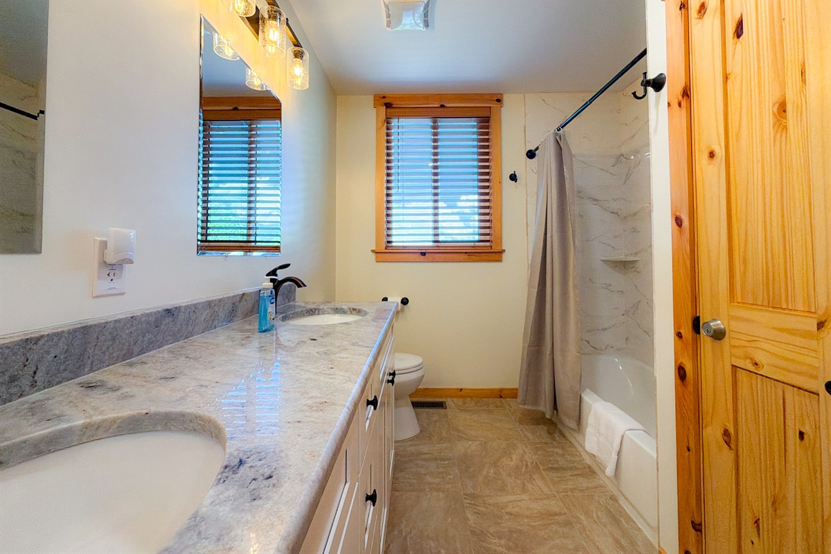 double vanity and plenty of space in the guest bathroom.