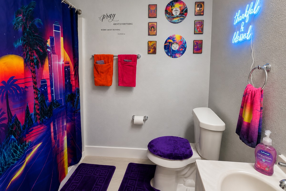 the full bathroom has a bidet installed inside the toilet