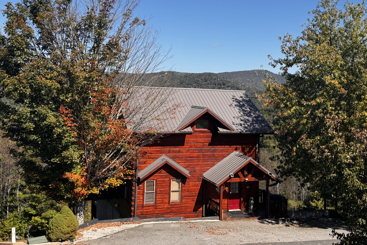 Welcome to Mars Hill Haven, a three-story log cabin in the Scenic Wolf mountain community near Hatley Pointe.