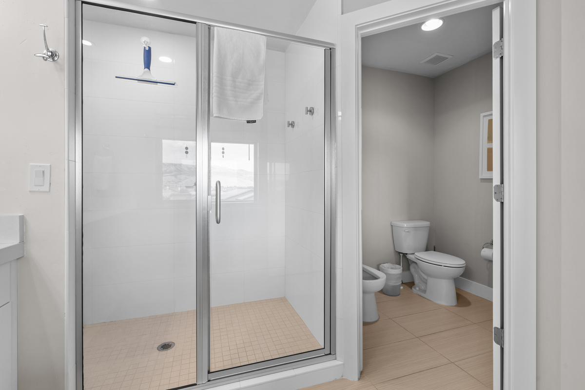 A spa-inspired walk-in shower offers the perfect place to unwind.