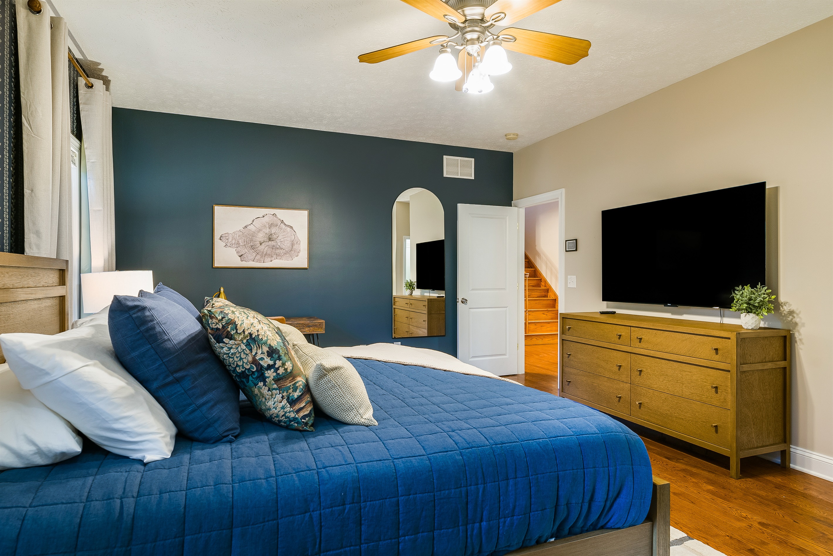 Relax into plush bedding, layered pillows, and calming colors — a peaceful place to recharge.