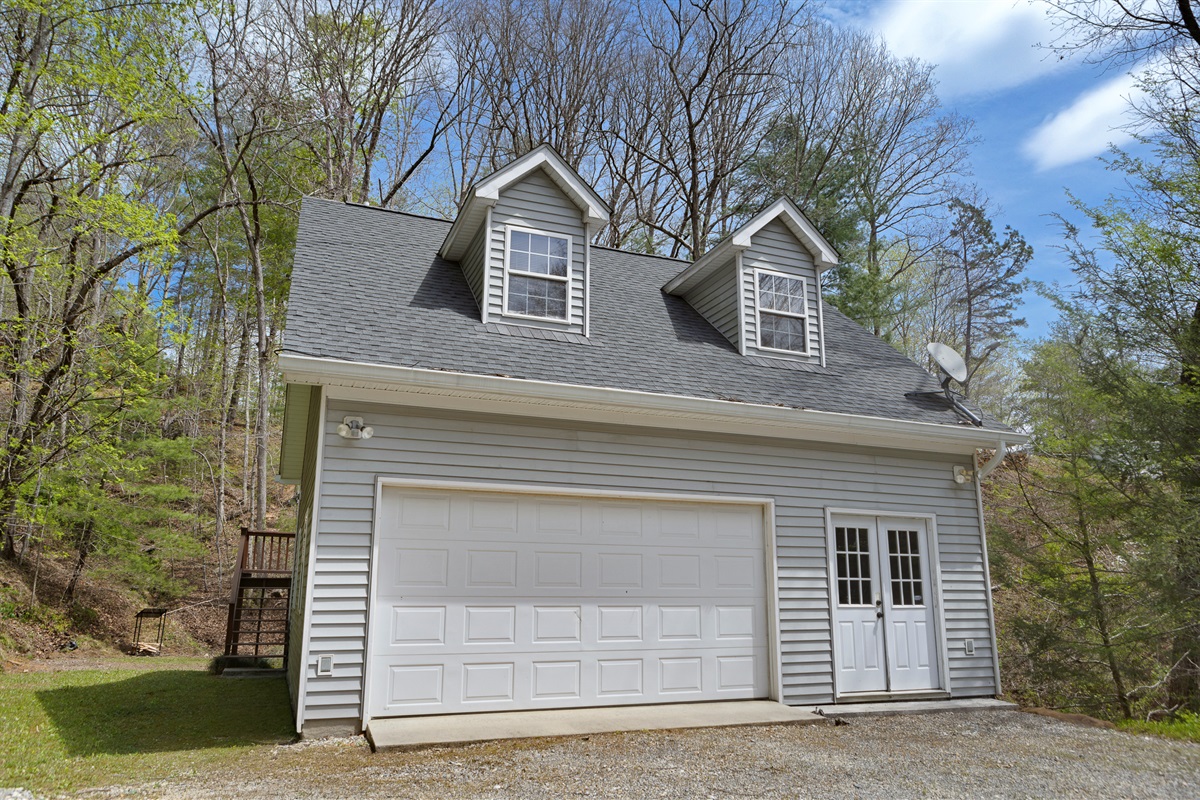 Exterior: Nestled among trees, this charming mountain retreat welcomes your adventure!