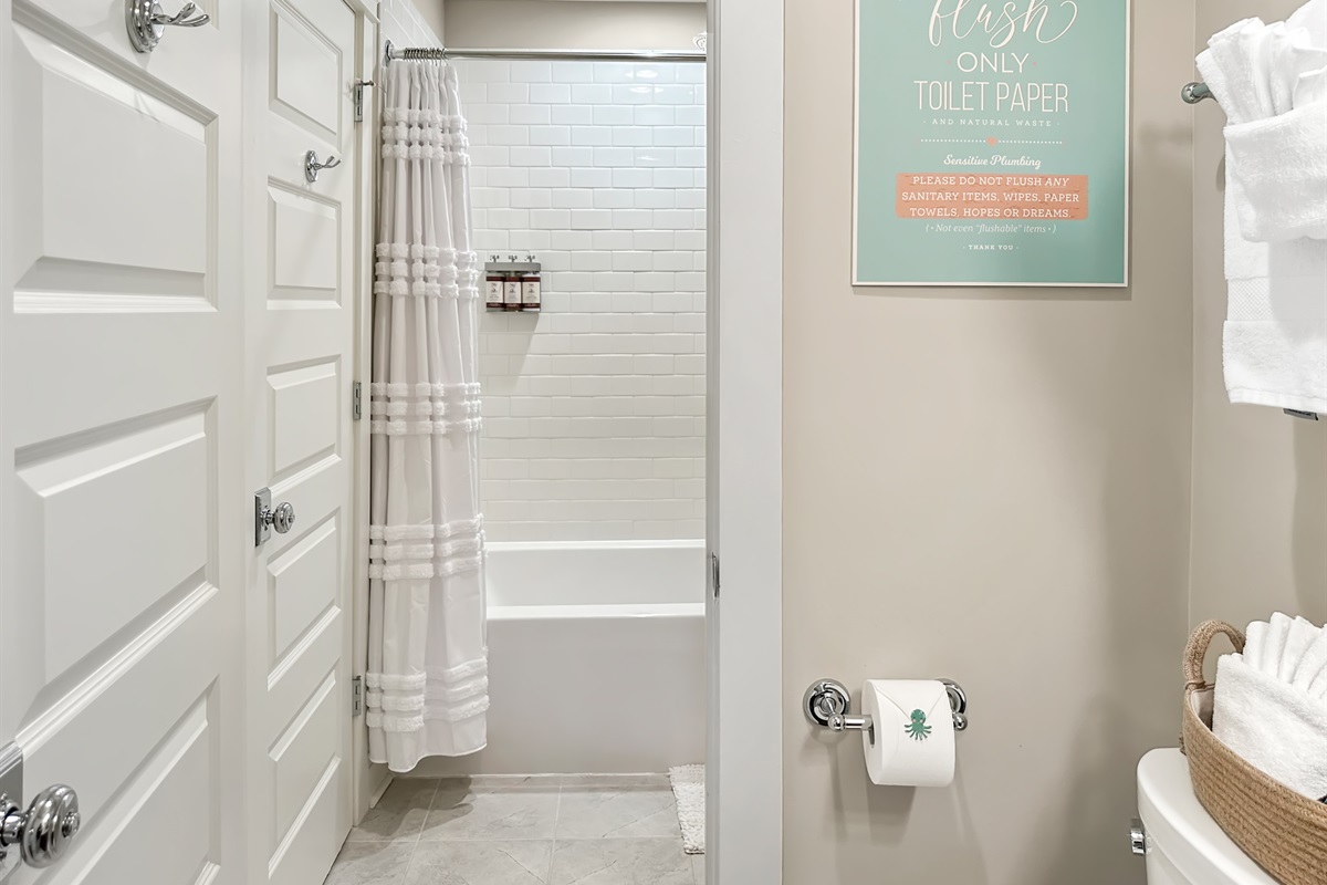 The en-suite bathroom has a tub/shower combo...