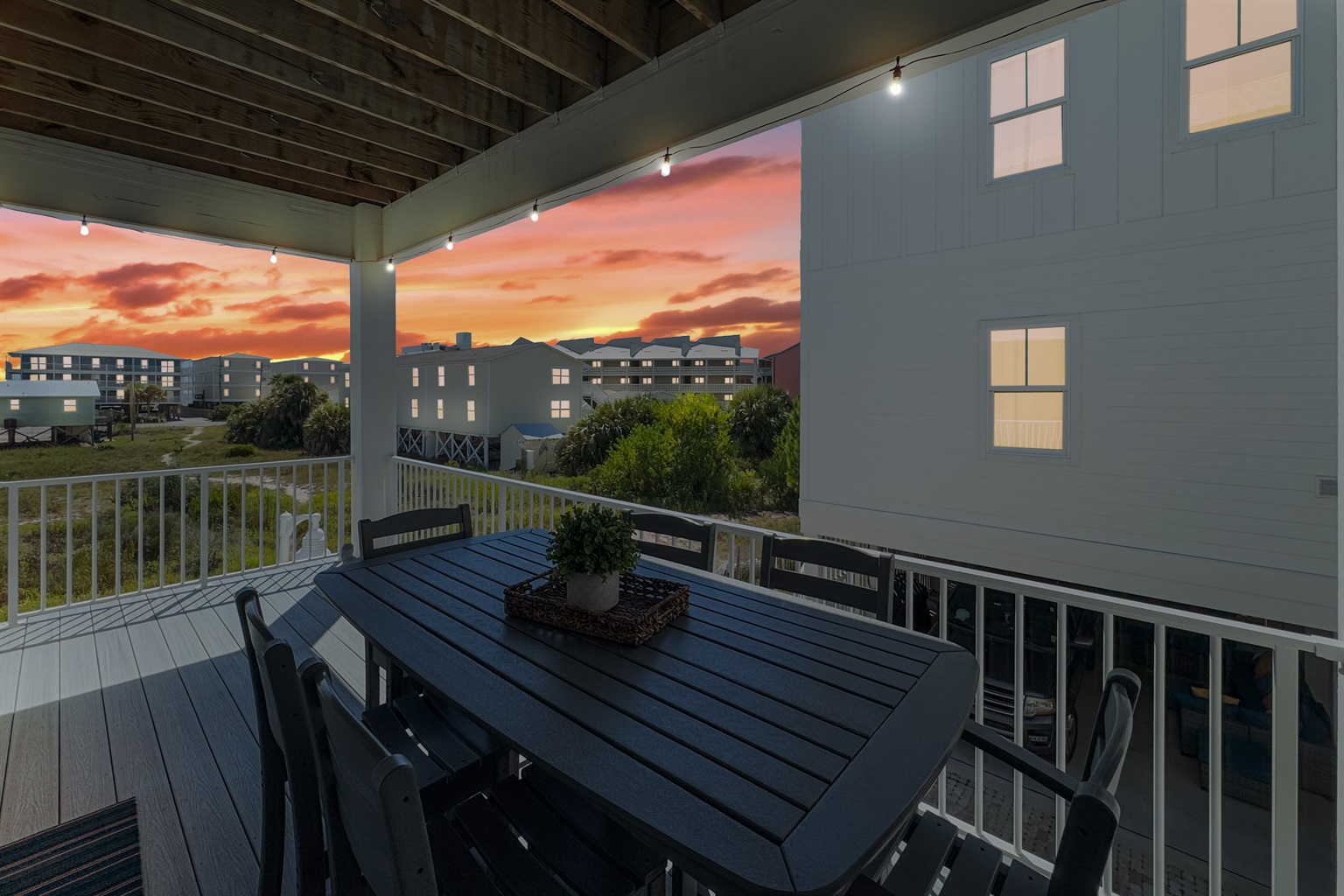 Wonderful large dining table on the balcony that has Gulf views while maintaining some quiet time since it not right on the road.