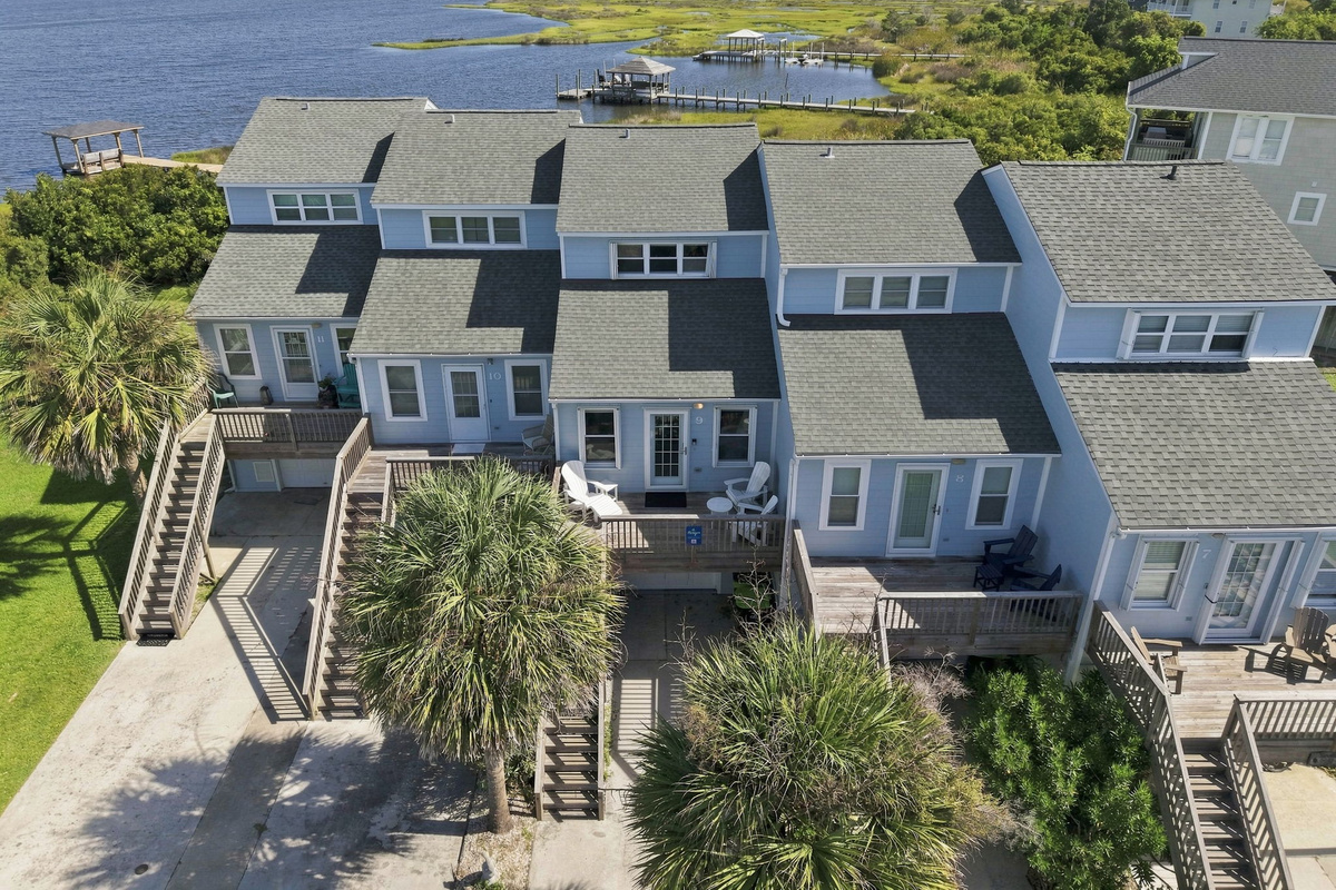 A gorgeous overhead look at the multi-level private decks and lush landscaping surrounding your coastal getaway.