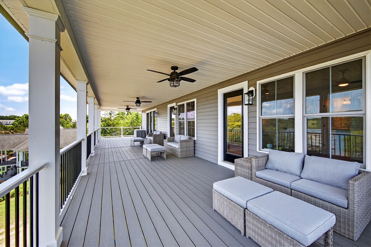 Private outdoor living with plush seating and tranquil lake views — designed for lingering conversations and quiet escapes.