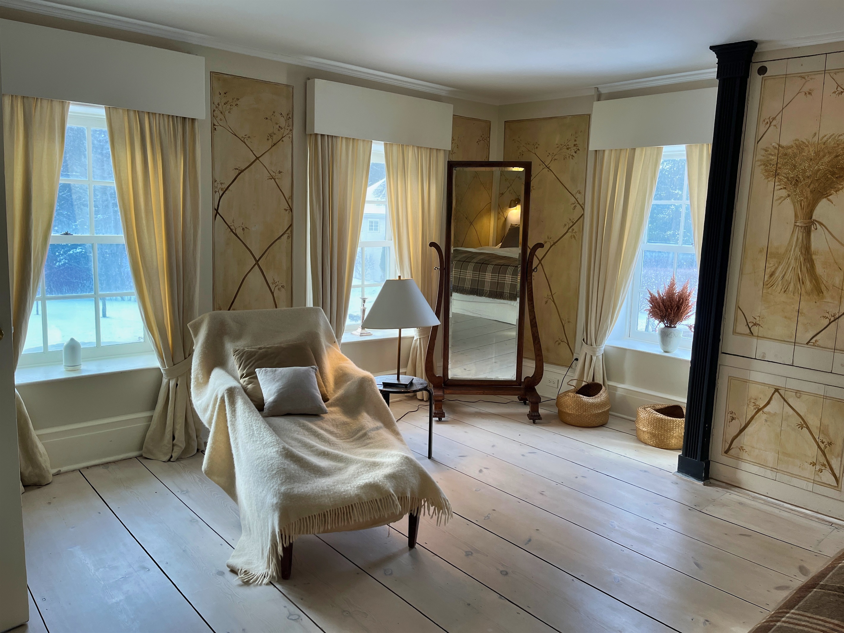 Hawk Field House - 2nd floor primary bedroom with custom hand painting on the walls.