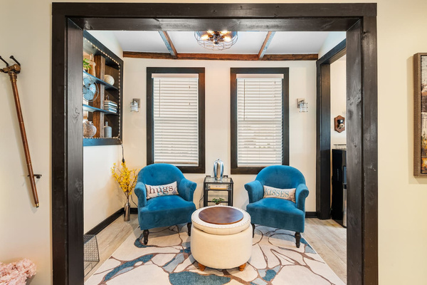 Kitchen sitting nook with two comfortable chairs for coffee or conversation.