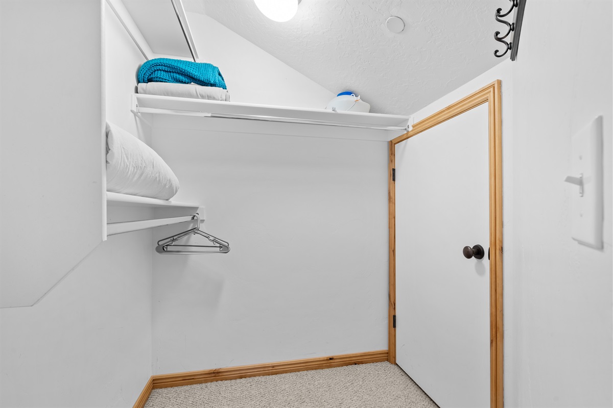 There is plenty of storage space available in the walk in closet.