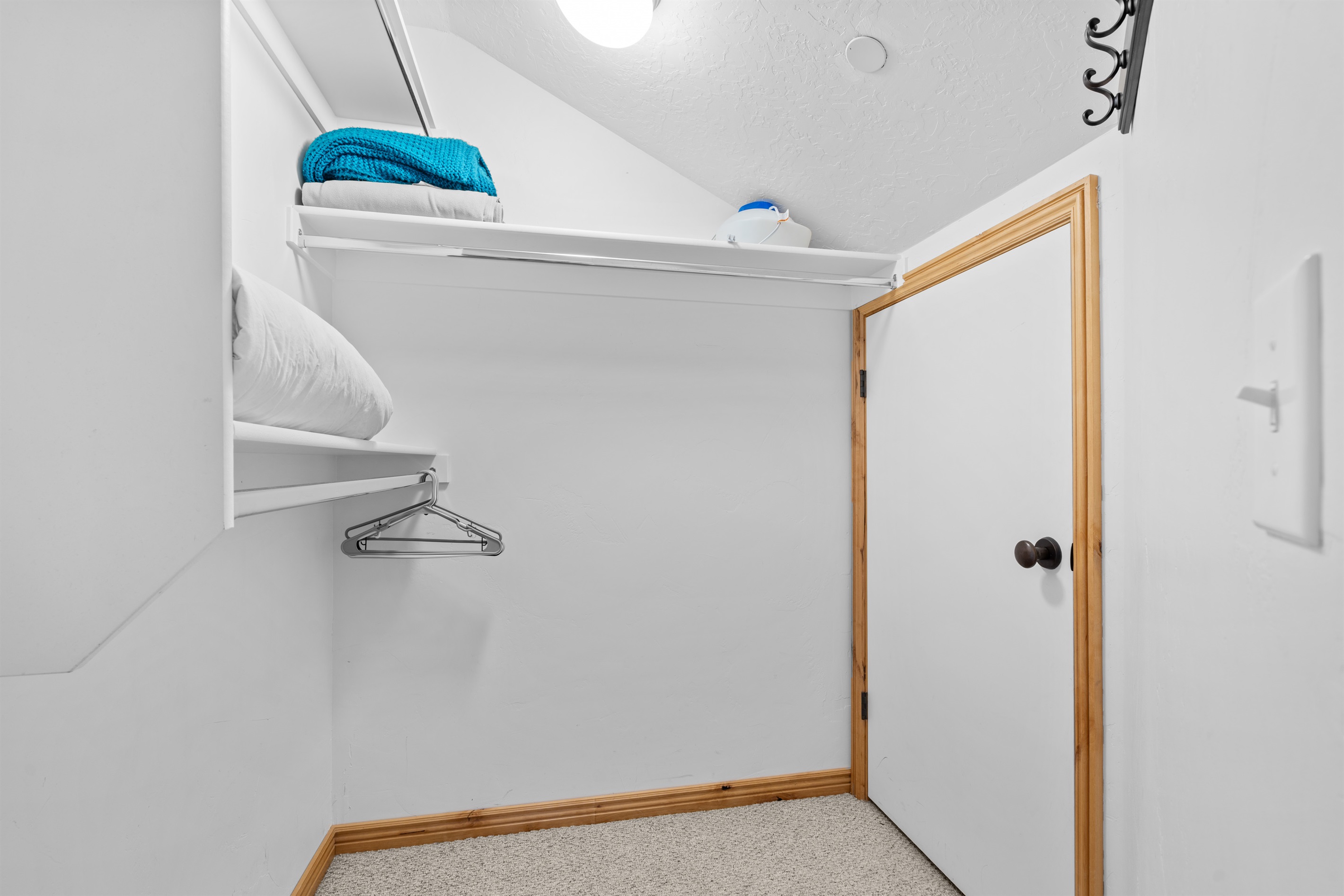 There is plenty of storage space available in the walk in closet.